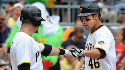 Pirates first baseman Garrett Jones, right, celebrates with catcher Ryan Doumit at home after Jones hits a solo home run.