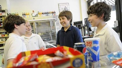 From left, Luke Farrell, Tommy Watson, Liam Fontes and Alex Stockman -- all seventh-graders at nearby St. Bede School -- stop in at the Frick Park Market several times a week to buy candy.
