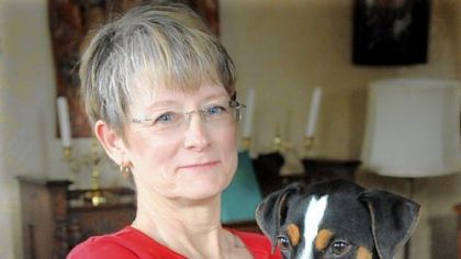 Gretta MacIntyre, founder of Sleep Tight,  and  Jack, a 2-year-old Jack Russell-rat terrier mix, who is trained to sniff out bedbugs. She uses a vial of bedbugs that she will hide, and Jack will find them.