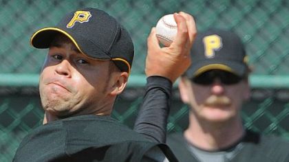 Pirates pitching coach Joe Kerrigan in the background keeps a close eye on pitcher Ian Snell.
