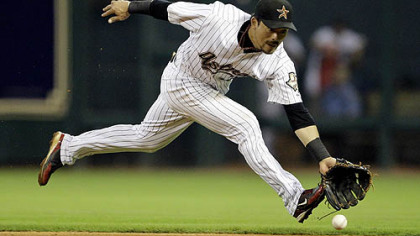Astros second baseman Kazuo Matsui reaches to field a ground ball hit by Pirates outfielder Brandon Moss during the seventh inning of last night's game. Moss was out at first on the play.