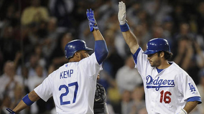 Dodgers outfielder Andre Ethier celebrates his two-run home run with teammate Matt Kemp at home plate during the fifth inning.