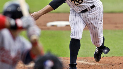 Pitcher Paul Maholm throws in the fourth inning against the Nationals.