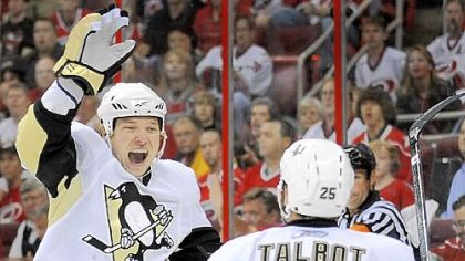 Ruslan Fedotenko celebrates a goal against the Hurricanes in the Eastern Conference final. Fedotenko, an unrestricted free agent, opted to take a pay cut and stay with the Penguins.