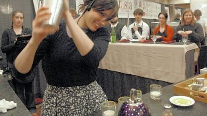 Dana Waelde of the Crazy Mocha in Oakland gets a reaction from the audience yesterday as she shakes her signature drink, Cafe Cioccolato, for the panel of judges at a regional barista competition at the Pittsburgh Marriott North in Cranberry.