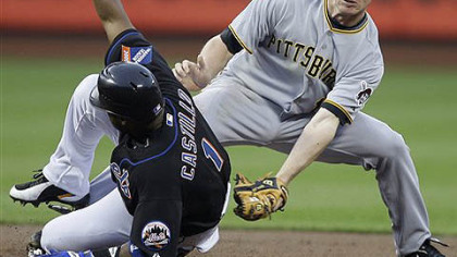 The Mets' Luis Castillo steals second base ahead of the tag from Pirates' shortstop Brian Bixler in the first inning of last night's game at Citi Field in New York.
