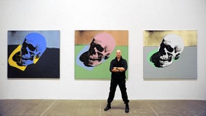 New Castle native Eric Shiner, the first Milton Fine Curator of Art at The Andy Warhol Museum, stands in front of Warhol's "Skulls" at the museum.