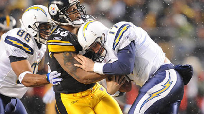 LaMarr Woodley sacks Chargers quarterback Philip Rivers in the first quarter.