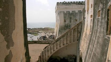 In this 2007 file photo, Ghanian fishermen return from fishing near Cape Coast Castle, which served as Britain's West Africa headquarters for the trans-Atlantic slave trade, in Cape Coast, Ghana. There has been some debate over recent restoration of the Ghanain slave castles, a project funded in part by $10 million from the U.S. government's Agency for International Development.