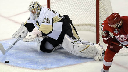 Goaltender Marc-Andre Fleury makes a save in front of Red Wings Dan Cleary in the first period of Game 7 of the Stanley Cup final in Detroit.