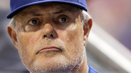 Cubs manager Lou Piniella stands in the dugout during last night's game.