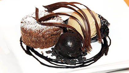 Mio Kitchen and Wine Bar's pastry chef Barbara Ferguson sweetens the menu with Hot Chocolate Cake with cocoa nib ice cream, dark chocolate sorbet, cocoa nib crisp and chocolate sauce.