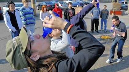 Justin Long, left, of Steubenville, Ohio, tries his best, but loses a Bawls energy drink chugging contest in an attempt to win a high-end graphics card for his computer during a break from the video game marathon.