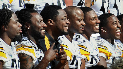 Steelers coach Mike Tomlin, third from left, poses with his players for the team photo at the end of media day Tuesday at Raymond James Stadium in Tampa, Fla.