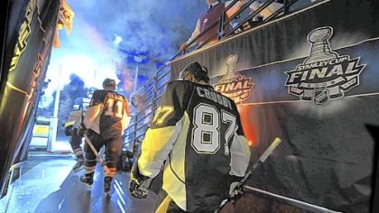 Penguins captain Sidney Crosby and teammates make their way to the ice.