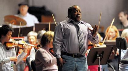 Sean Lomax, world champion whistler, rehearses for a solo performance with the Edgewood Symthony.