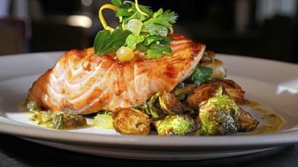 On the menu at Eleven:  Scottish salmon, with fingerling potatoes, black pepper bacon, brussels sprouts and caper vinaigrette.