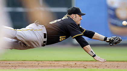 Pittsburgh third baseman Eric Hinske dives for a ball hit by Houston Astros' Hunter Pence during the first inning the game yesterday.