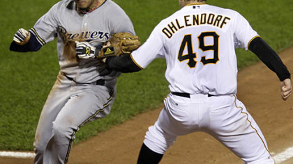 Pirates pitcher Ross Ohlendorf tags out Brewers second baseman Felipe Lopez to end a fifth-inning rundown between third and home.