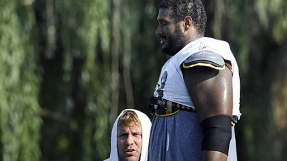 Ben talks with Max Starks, who fell on him during pass drills near the end of practice.