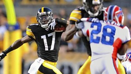 Rookie Mike Wallace picks up a first-half first down.