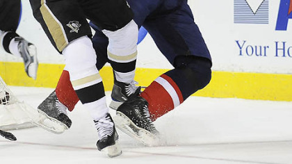 Ruslan Fedotenko takes out Milan Jurcina early in last night's Game 7 at the Verizon Center in Washington.