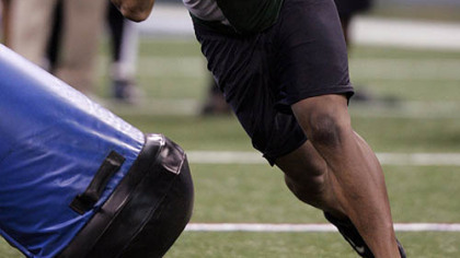 Missouri defensive lineman Evander Hood runs a football drill at the NFL scouting combine in Indianapolis, Feb. 23, 2009.