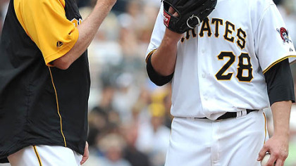 Pirates pitching coach Joe Kerrigan talks with starting pitcher Paul Maholm.