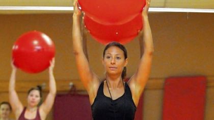 Maria Caruso uses ballet moves in her exercise class at Club One, Shadyside.