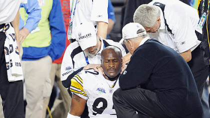 James Harrison collapses in the end zone after a 100-yard interception return at the end of the first half of Super Bowl XLIII.