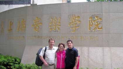 Pittsburgh Symphony Orchestra musicians William Caballeo (L), Nancy Goeres and Michael Rusinek, pose outside the Shanghai Conservatory in May before they give master classes during the PSO tour to Asia.