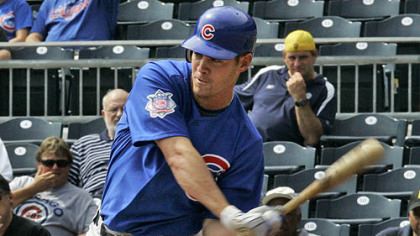 Cubs outfielder Micah Hoffpauir hits a solo home run to right field off Pirates pitcher Kevin Hart in the fifth inning.