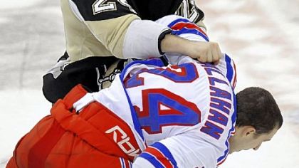 Penguins forward Matt Cooke fights Rangers forward Ryan Callahan in the third period of Saturday night's game.