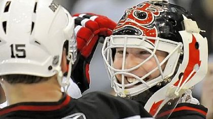 Devils goalie Martin Brodeur is all smiles after shutting out the Penguins and breaking the record for career shutouts with 104.