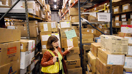Kathleen Hower, Executive Director of Global Links, is dwarfed by a shipment being assembled for Guatemala in the organization''s warehouse in Pittsburgh''s Homewood neighborhood.