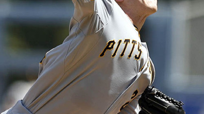 Pirates starting pitcher Kevin Hart delivers against the Dodgers during the first inning of yesterday's game in Los Angeles.