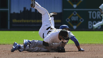 Pirates shortstop Delwyn Young completes a double play as he collides with Dodgers outfielder Matt Kemp at second base.