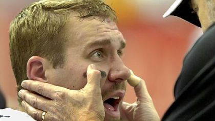 Steelers team physician Dr. Anthony Yates checks Ben Roethlisberger on the sideline after he was knocked out of the game against Atlanta midway through the third quarter when he took a hit to the head on a sack on Oct. 23, 2006.