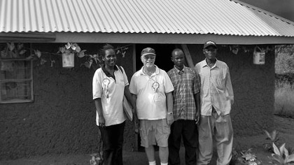 ... and the group outside Stephen's new home -- which, though it lacks plumbing or electricity, sparkles in comparison.