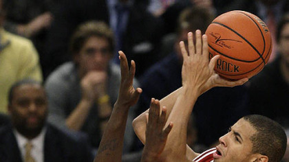 Indiana guard Verdell Jones III shoots over Pitt guard Travon Woodall in the first half.