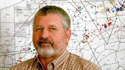 Ray N. Walker Jr., vice president of the Marcellus Shale division at Range Resources in Canonsburg, with a map of the active natural gas wells in Pennsylvania.