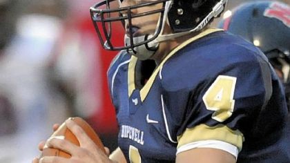 Hopewell quarterback Matt Hundenski looks to pass against New Castle in the first half last.