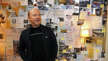Paul Haggis, director of "The Next Three Days," starring Russell Crowe, Elizabeth Banks and Liam Neeson,  stands in front of the bedroom wall where the Crowe character makes plans and budgets to get his wife out of prison.