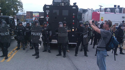 Protesters confront a police blockade on Liberty Avenue.