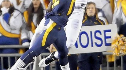 West Virginia's Brandon Hogan knocks a pass away from Pitt wide receiver Jonathan Baldwin Friday night at Mountaineer Field.