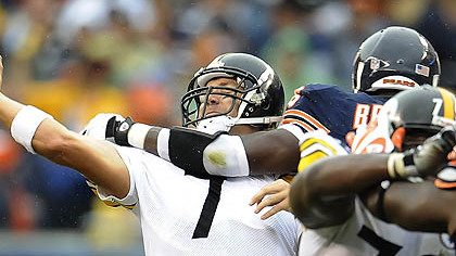 The Bears' Alex Brown pressures Ben Roethlisberger yesterday.