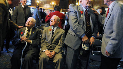 The honored veterans, from left: Ross DiMarco and Martin Tougher, both seated, and Felix Cistolo and Francis Culotta, standing.