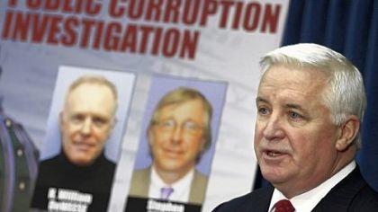 Attorney General Tom Corbett holds a news conference yesterday in Harrisburg on new Bonusgate charges.