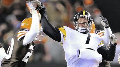 Steelers quarterback Ben Roethlisberger is hit by Browns safety Mike Adams in the fourth quarter of last night's game at Cleveland Browns Stadium.