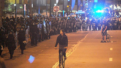 Police units assemble in response to a gathering of protesters and students in Schenley Plaza last night.